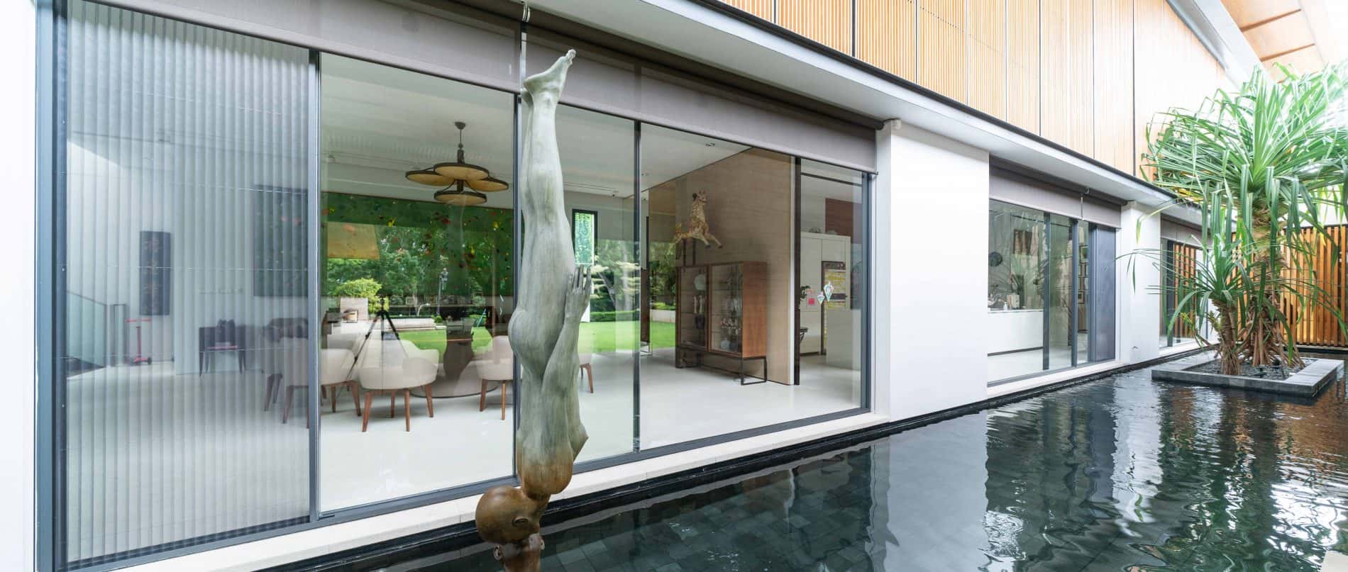 SKY-FRAME Sliding doors with inbuilt SKY-FRAME FLY insect screen at 46 Nassim Road by  Ernesto Bedmar Architects Pte Ltd